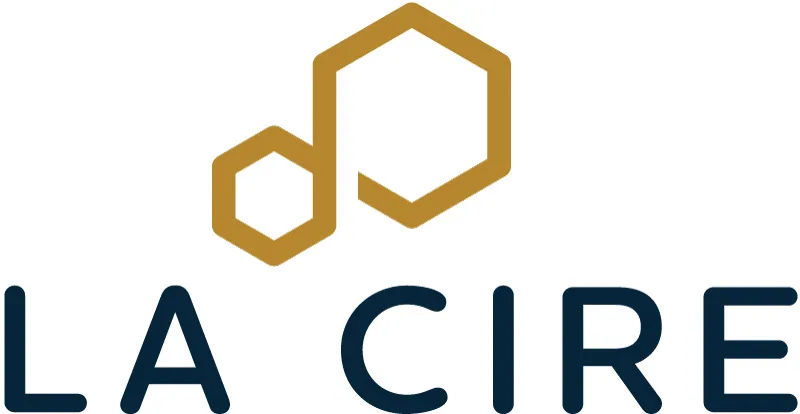 La Cire logo featuring two overlapping gold hexagon outlines above navy text reading LA CIRE