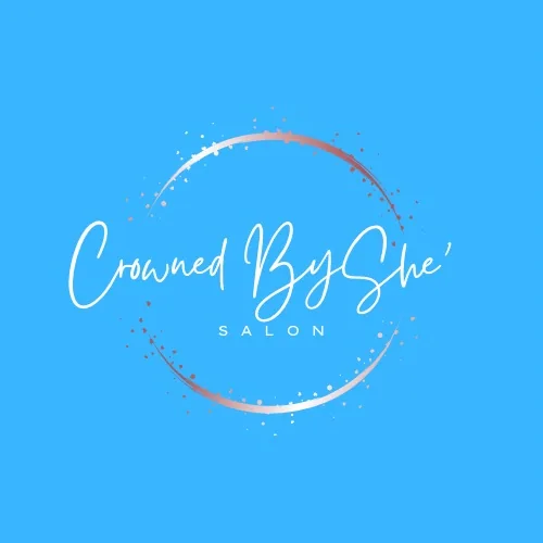 Crowned By She Salon logo with cursive text inside a decorative circular brushstroke on blue background