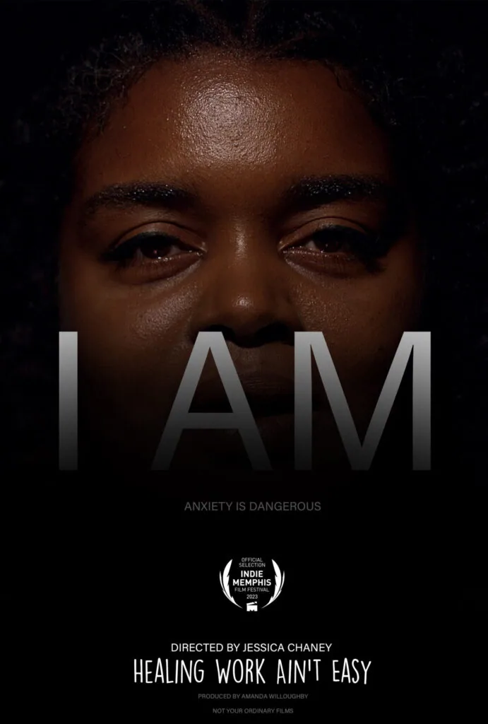 Close-up portrait of a person's face with serious expression and text overlay reading 'I AM' with tagline 'Anxiety is Dangerous' and film credits below